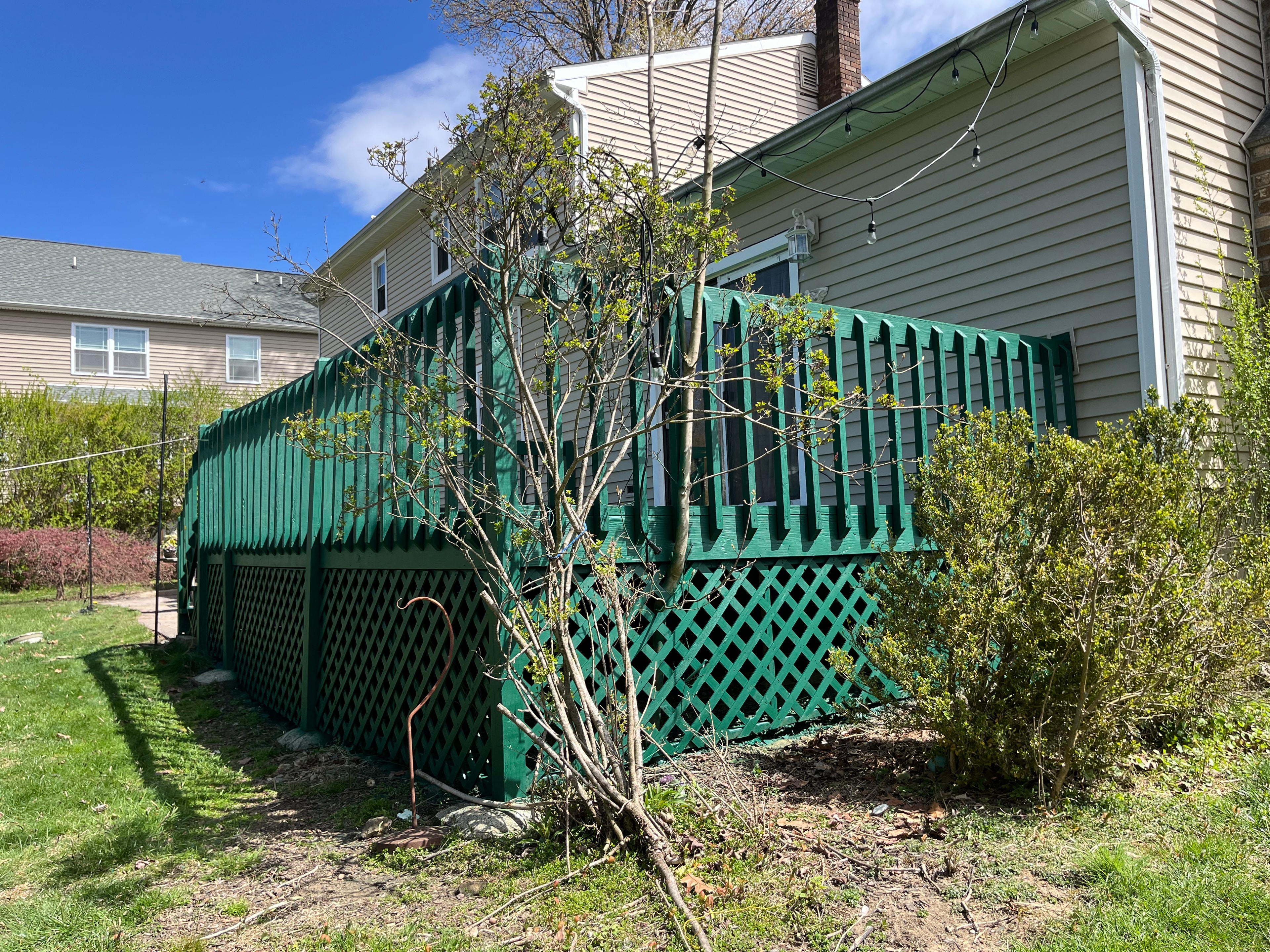 Custom green deck staining with professional lattice work